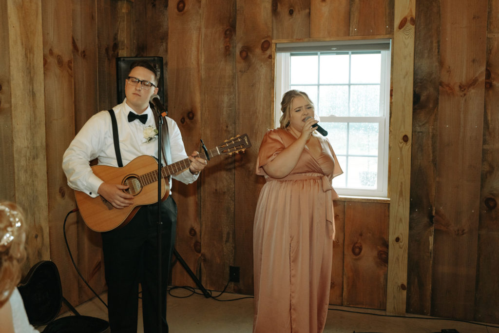 Friend sings while Bride walks down aisles. Practical Tips for Planning Your Wedding 